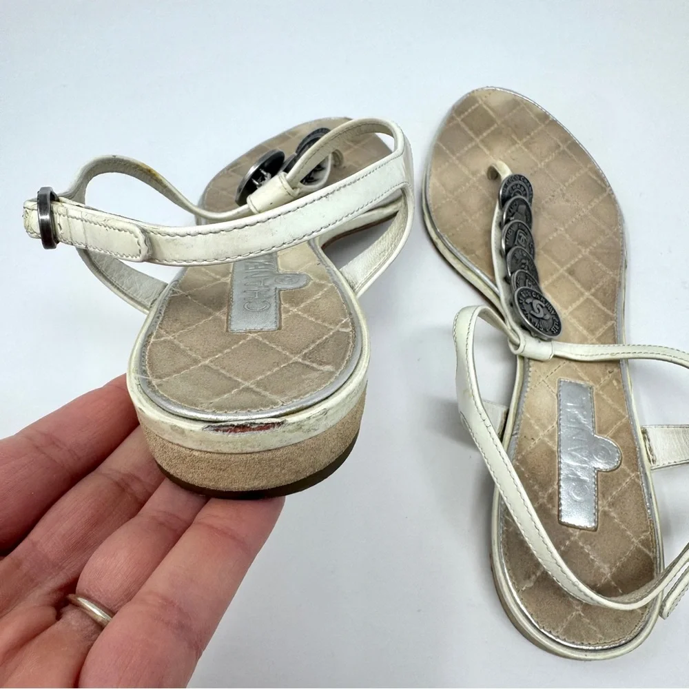 CHANEL White Leather Thong Sandals with Stacked Silver Coin Medallions